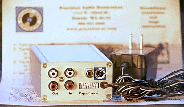 The Derumbleizer package with power supply and instructions